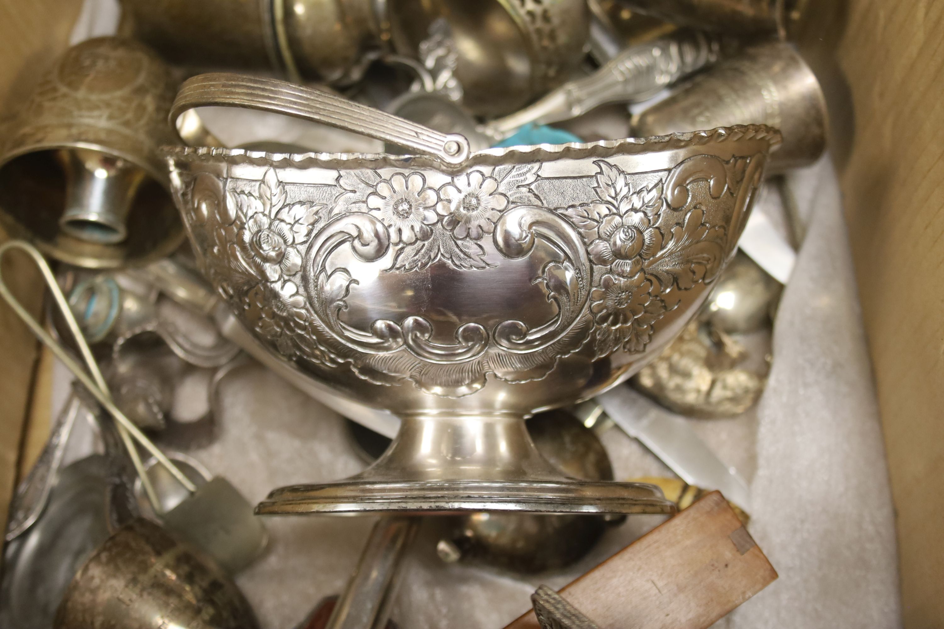 A quantity of plated tableware and cutlery